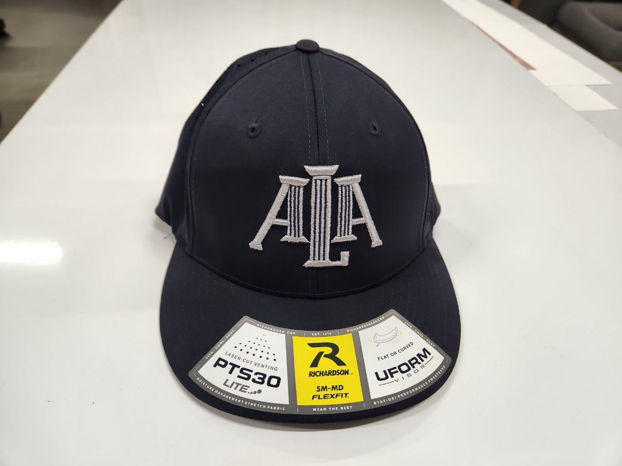 Navy Richardson PTS30 hat with white embroidered ALA monogram